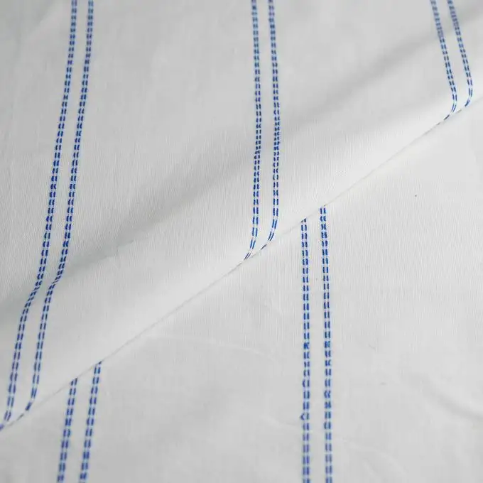 Tessuto voile cotone slub ecru doby linea blu