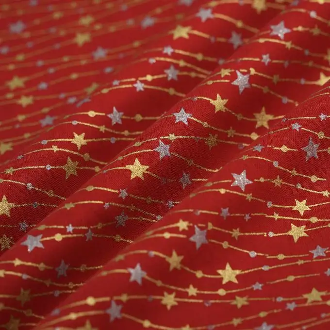 Tessuto cretonne natalizio ghirlanda stella oro