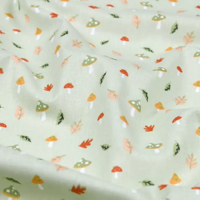 Tessuto cotone 52 fili stampato champignon in follia mandorla