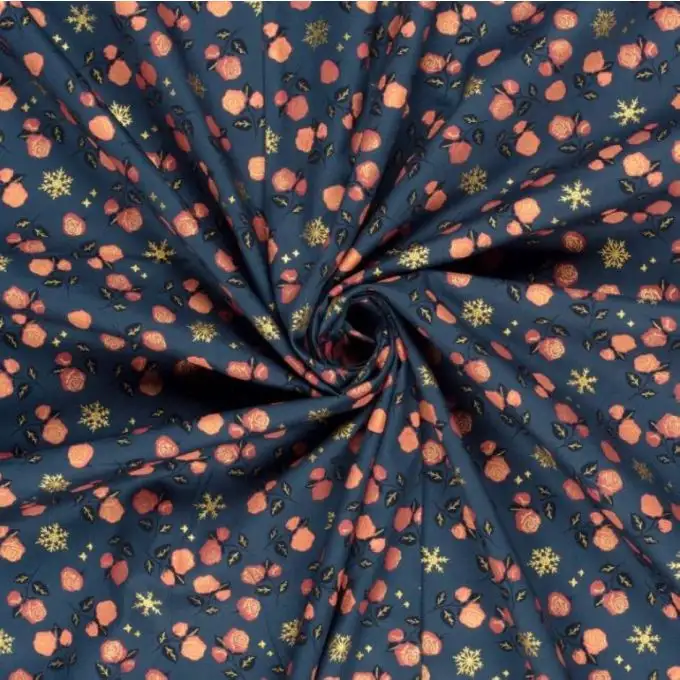 Tessuto cotone natalizio stampato rosa fiocchi dorati blu