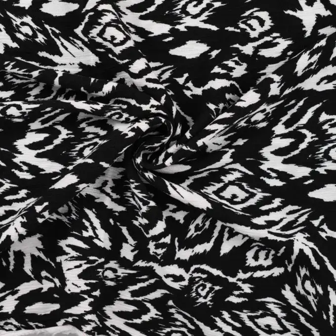 Tessuto crepe viscosa stampato rombi psichedelico nero