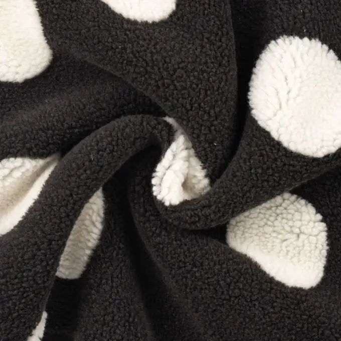 Tessuto bouclé stampato pois nero