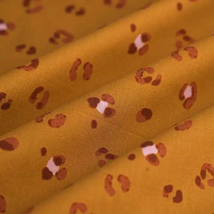 Tessuto popeline cotone leopardo cammello