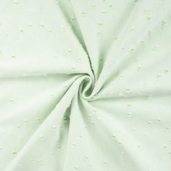 Tessuto denim elasticizzato stampato con foro leggero verde chiaro