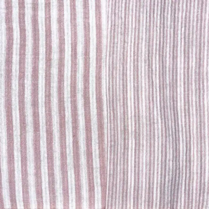 Tessuto a doppio strato rigato rosa antico e bianco sporco