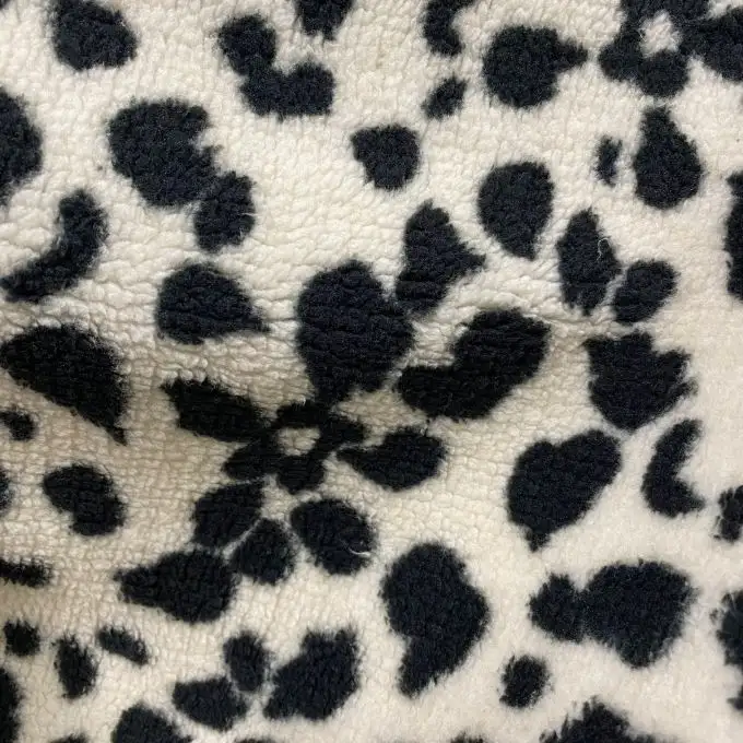 Tessuto sherpa floreale nero e bianco