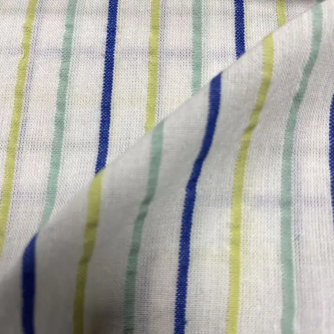 Tessuto cotone goffrato righe tricolori sottili verde e blu