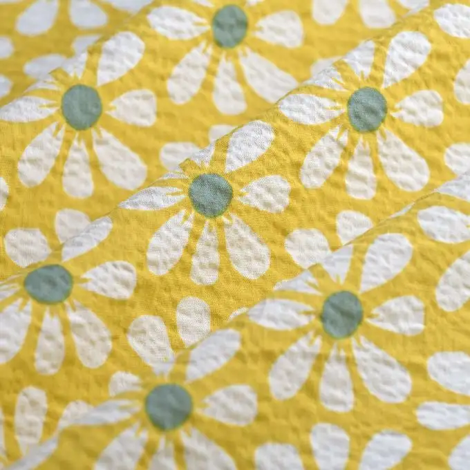 Tessuto seersucker fiore medio ecru zafferano