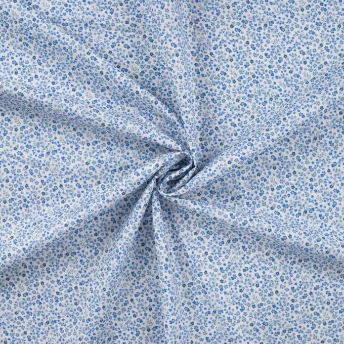 Tessuto voile cotone stampato mini fiore blu