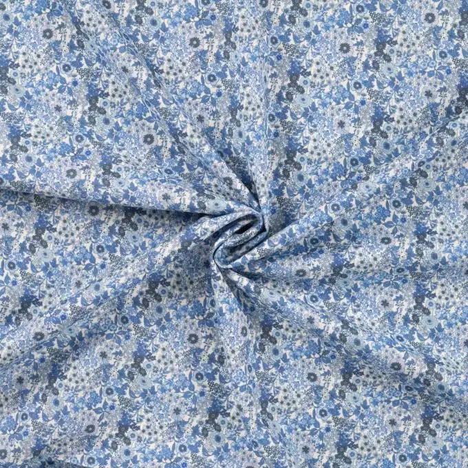 Tessuto voile cotone stampato fiori in festa blu