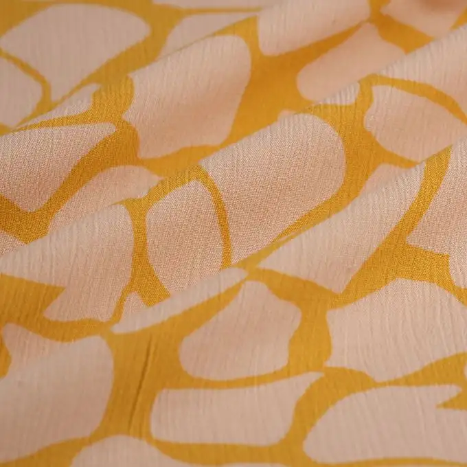 Tessuto crepe viscosa forme curry rosa
