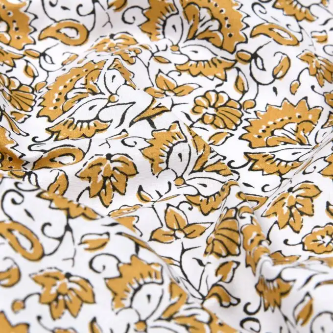 Tessuto cretonne rivestito stampa vegetazione invernale senape