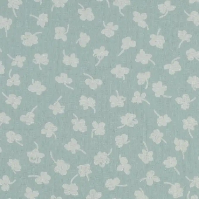 Tessuto in doppia garza biologica stampato trifoglio bicolore verde acqua e ecru