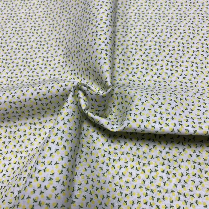Tessuto voile di cotone morbido bianco mini fiori gialli