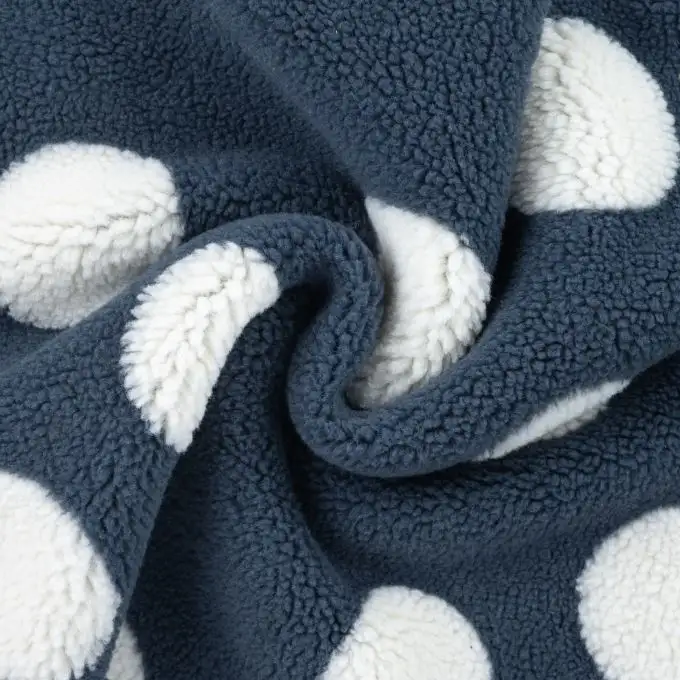 Tessuto bouclé stampato pois blu