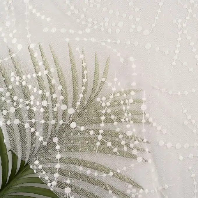 Tulle morbido bianco ricamato linee pois