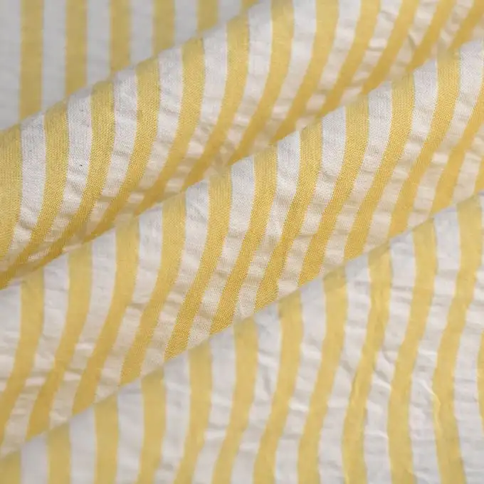 Tessuto seersucker righe giallo ecrù