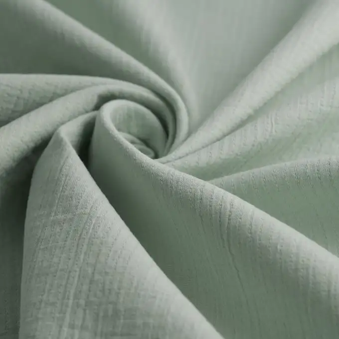 Tessuto doppio garza unito verde morbido