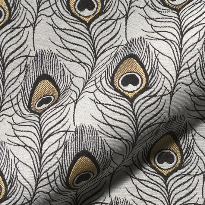 Tessuto jacquard spesso bianco piume pavone nero e oro