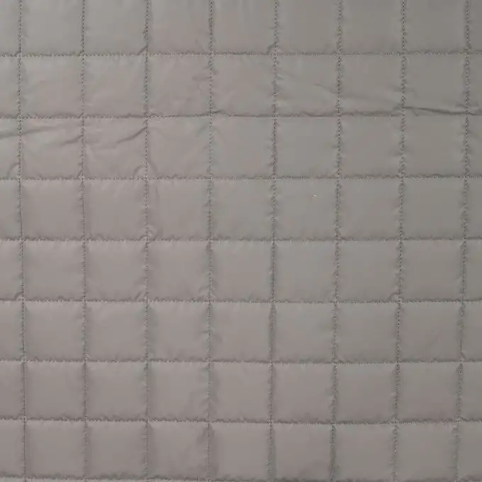 Tessuto trapuntato riflettente