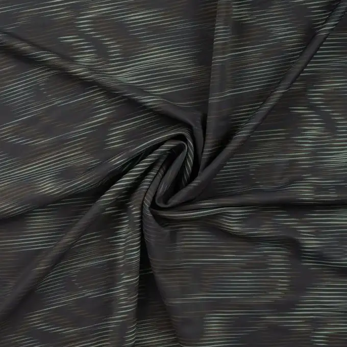 Tessuto tecnico sportivo stampato onda verde mandorla