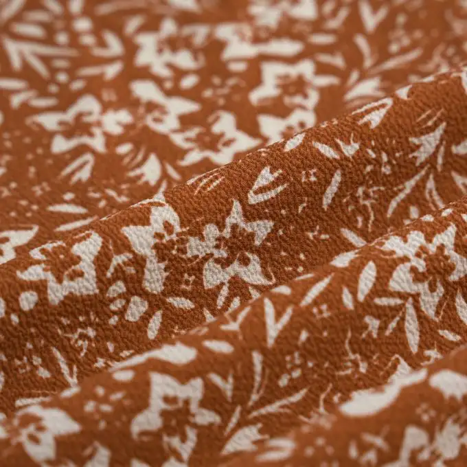 Tessuto crêpe poliestere fiori bicolore bianco caramello
