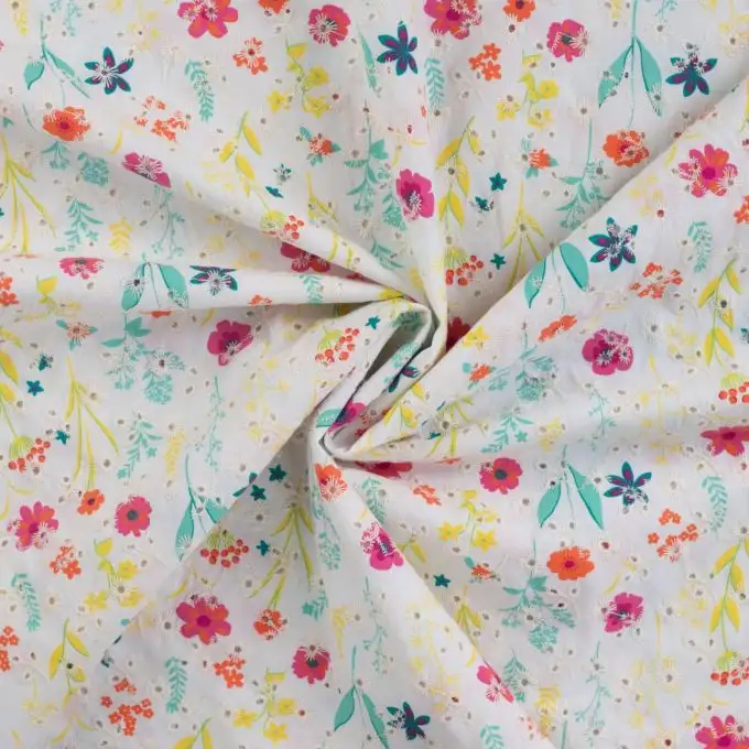 Tessuto cotone ricamato giardino fiorito rosa fucsia