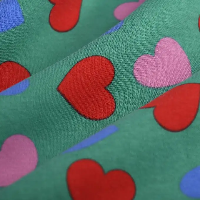 Tessuto felpato cuore multicolore verde