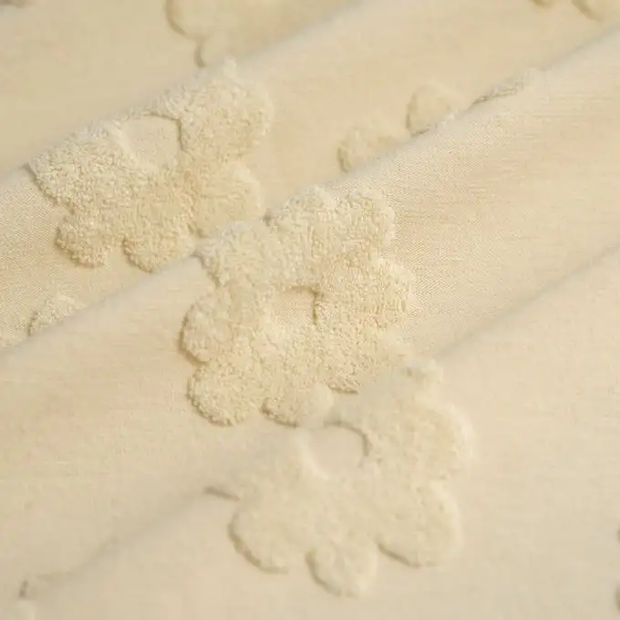 Tessuto spugna fiore rilievo ecru