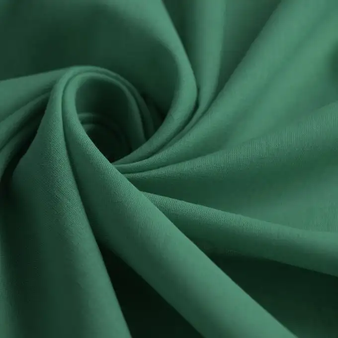 Tessuto voile di cotone unito olivia verde prato