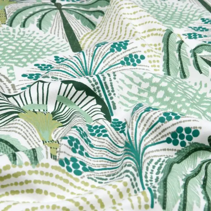 Tessuto in cotone stampato palme geometriche verdi