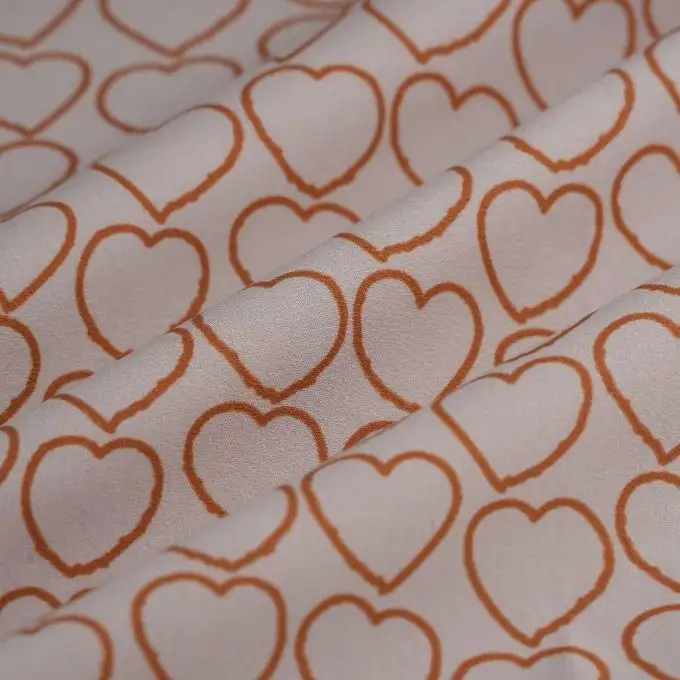 Tessuto popeline cotone cuore tratto bordeaux ecru