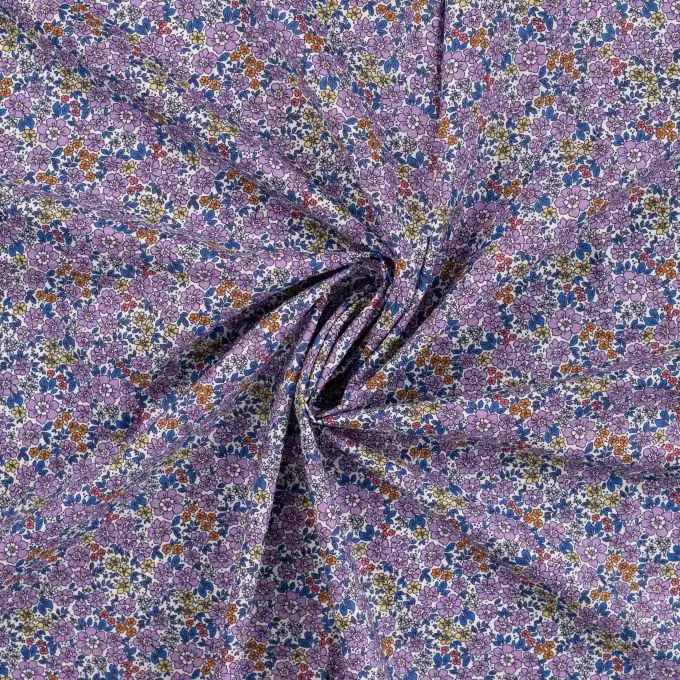 Tessuto voile cotone stampato piccole fioriture lilla