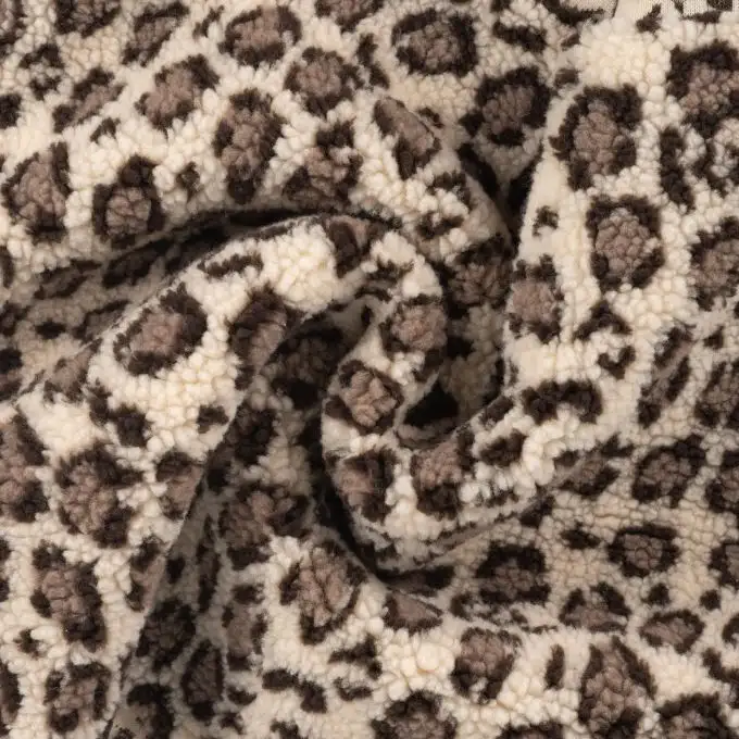 Tessuto bouclé stampato leopardo beige