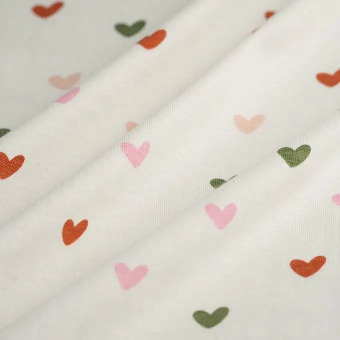 Tessuto jersey cotone cuore rosa verde ecru