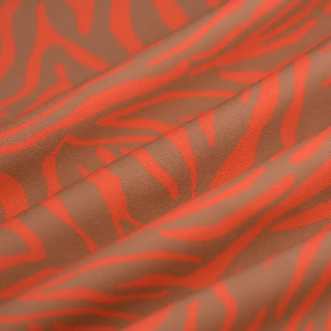 Tessuto tela poliestere effetto tigre corallo beige