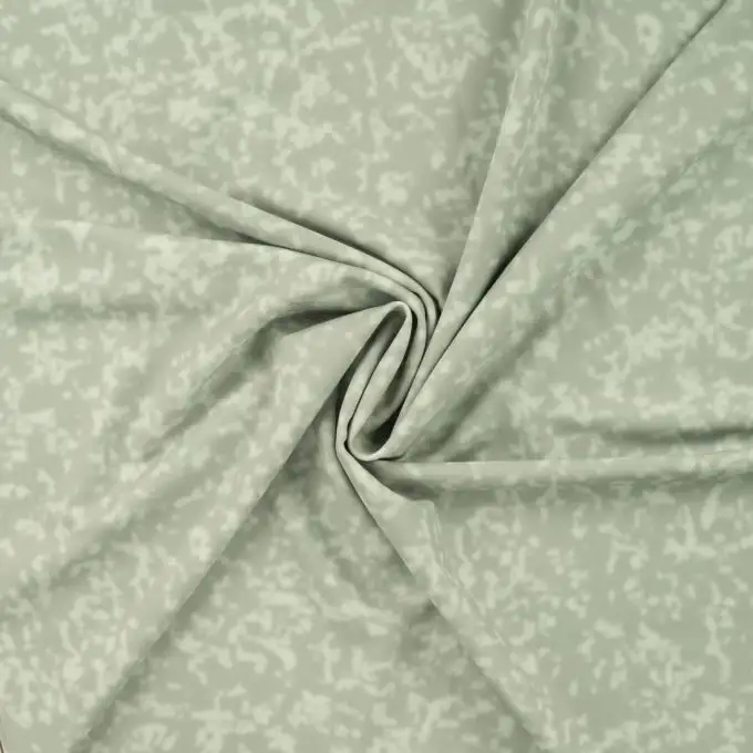 Tessuto tecnico sport falso unito verde mandorla