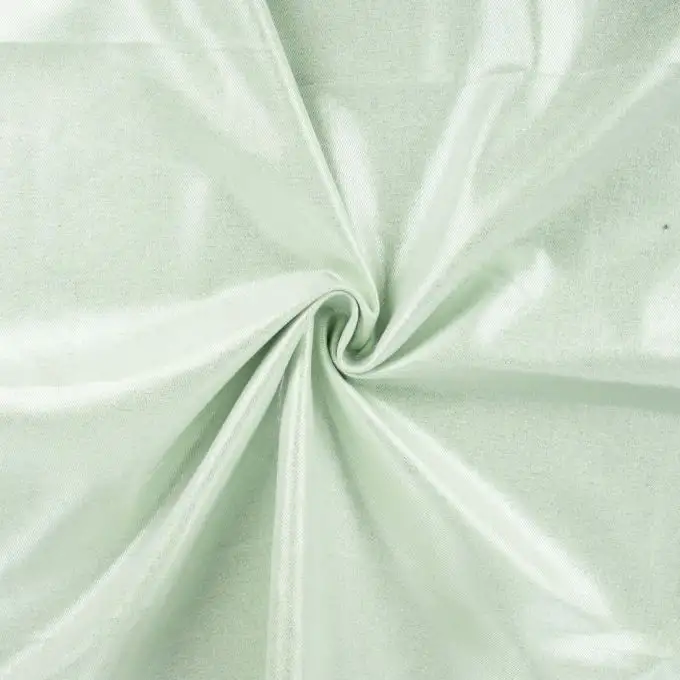 Tessuto denim elasticizzato stampato glitterato verde chiaro