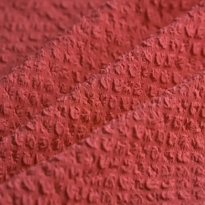 Tessuto voile poliestere elastan goffrato unito rosa