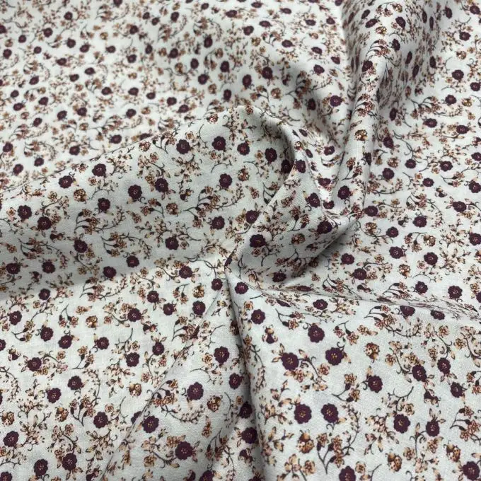 Tessuto voile di cotone morbido bianco rami fioriti bordeaux