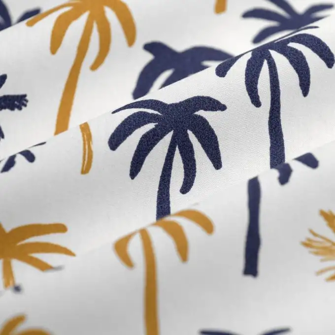 Tessuto popeline cotone palma ocra blu