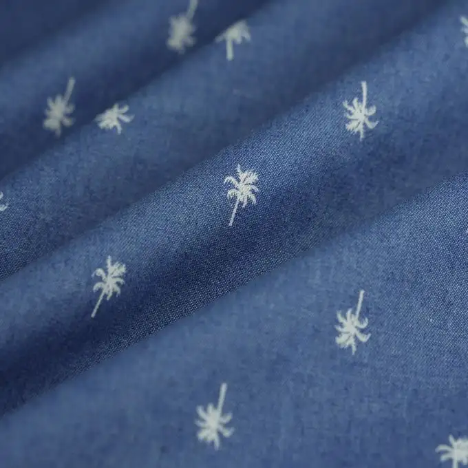 Tessuto chambray palme ecru blu